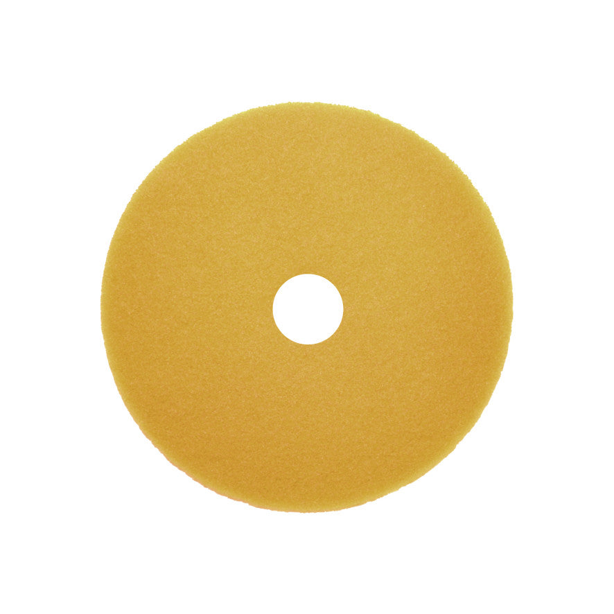 Ein gelber, kreisförmiger Arcora Sunshine Fine No3 Block (Karton, 10 Stück) von Arcora International GmbH mit Mittelloch, von oben gesehen auf weißem Hintergrund - perfekt als Reinigungsartikel für die gewerbliche Reinigung.