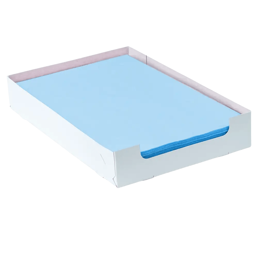 A neatly arranged stack of blue AMPri Dental crepe tray filter papers (18 x 28 cm) is presented in a white cardboard tray with open sides. This rectangular tray keeps the paper perfectly aligned and gives it a minimalist look, making it ideal for organized dental care routines, provided by AMPri Handelsgesellschaft mbH.