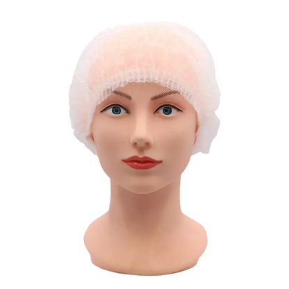 A mannequin head with light skin tone wears an AMPri ECO-PLUS clip cap from AMPri Handelsgesellschaft mbH. This white disposable hair net, designed for the medical field, fits snugly and completely covers the hair. The mannequin also has blue eyes and red lips.