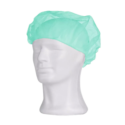 A light blue AMPri MED-COMFORT beret cap from AMPri Handelsgesellschaft mbH is shown on a white mannequin head. The disposable cap fully covers the top and back of the head and is often used in hygienic applications such as medical or cleanroom environments to ensure hygiene. The mannequin's face is expressionless and without contours.