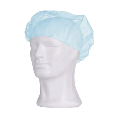 A light blue AMPri MED-COMFORT beret cap from AMPri Handelsgesellschaft mbH is depicted on a white mannequin head. It is designed to cover the hair and is often used in the medical field, food industry, or laboratories to ensure hygienic applications.