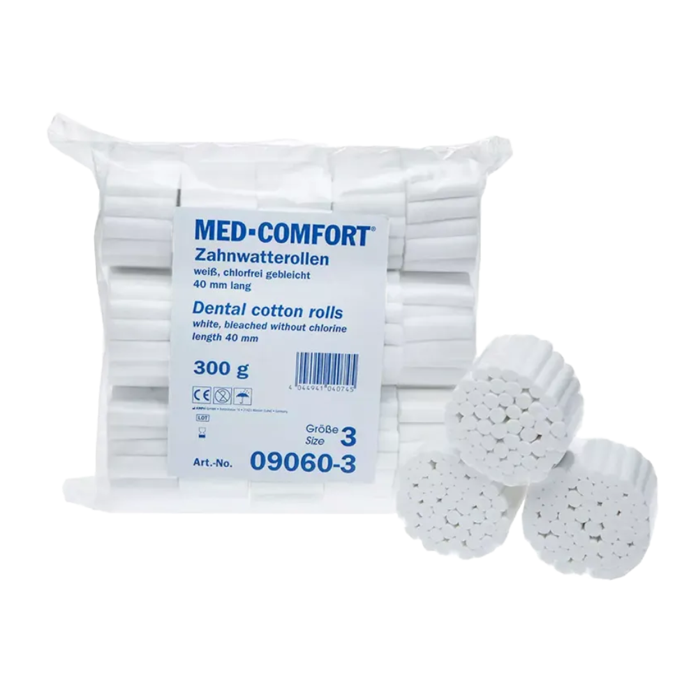 A package labeled "AMPri MED-COMFORT Dental cotton rolls" contains several white, cylindrical rolls made from chlorine-free bleached cotton. Three individual rolls are shown at the front. The package indicates size 3, measures 40 mm in length, weighs 300 grams, and is suitable for single use.