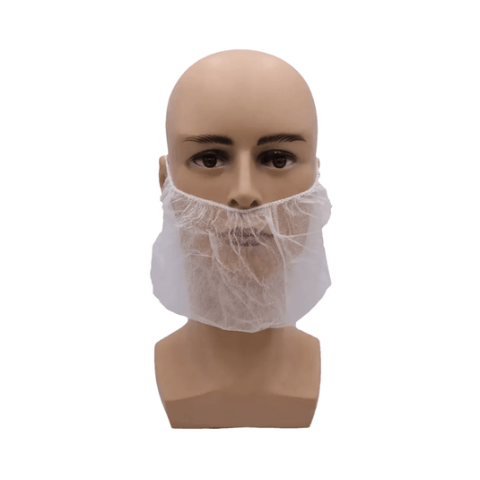 The image shows a bald mannequin head wearing a white AMPri MED-COMFORT PP beard mask from a 100-piece package manufactured by AMPri Handelsgesellschaft mbH. The beard mask, made of spunbond polypropylene, fits snugly around the chin and jaw area and covers the lower half of the face. The background is plain white.