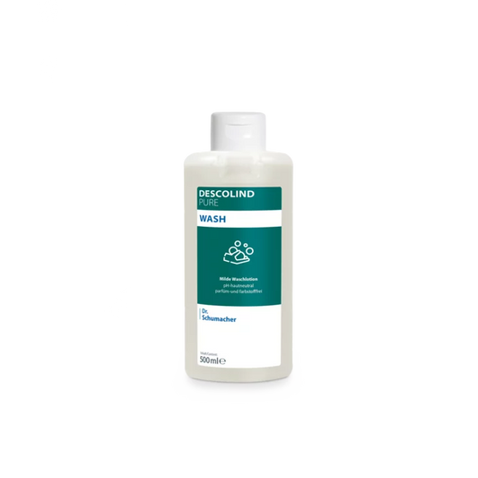 Eine weiße Kunststoffflasche der Dr. Schumacher Descolind Pure Wash Waschlotion (500 ml) von Dr. Schumacher GmbH, mit einem grün-weißen Etikett, steht vor einem schlichten hellgrauen Hintergrund. Diese pH-hautneutrale parfümfreie Waschlotion ist ideal für sensible Haut.