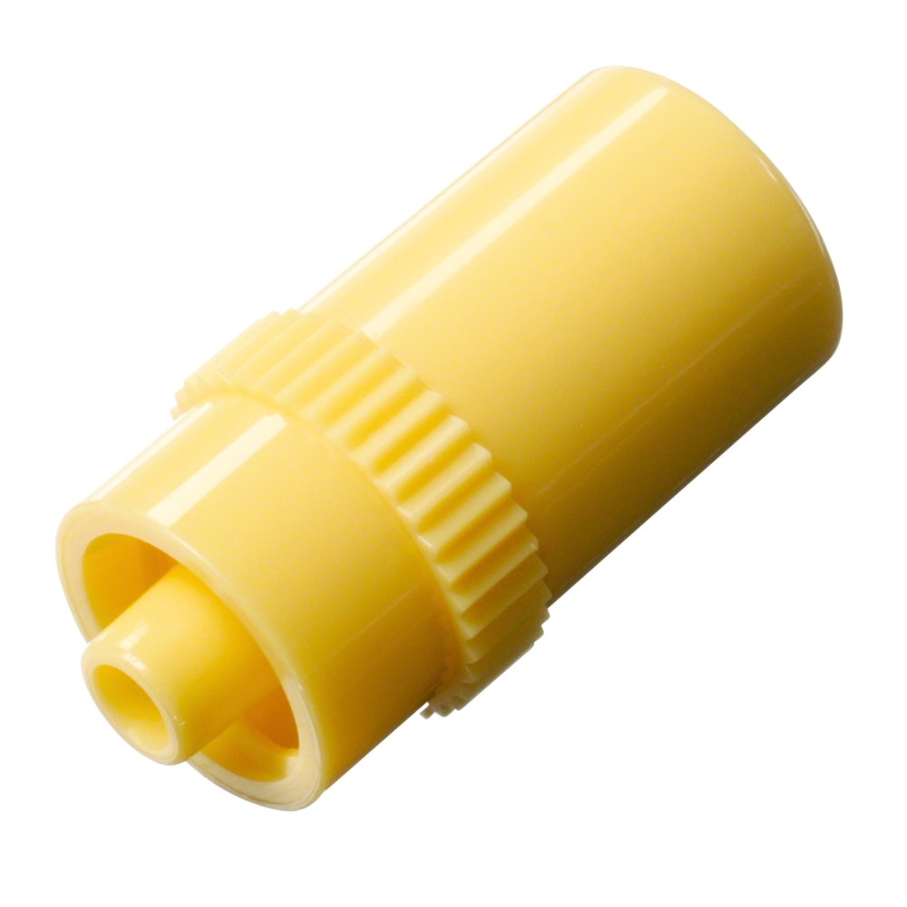 A cylindrical yellow plastic adapter, similar in design to the B.Braun IN-Stopper injection possibility through injection membrane by B. Braun Deutschland GmbH & Co. KG, with a ribbed middle section, an open end, and a smaller protrusion on the other side. It is made from latex-free material for safe medical applications.