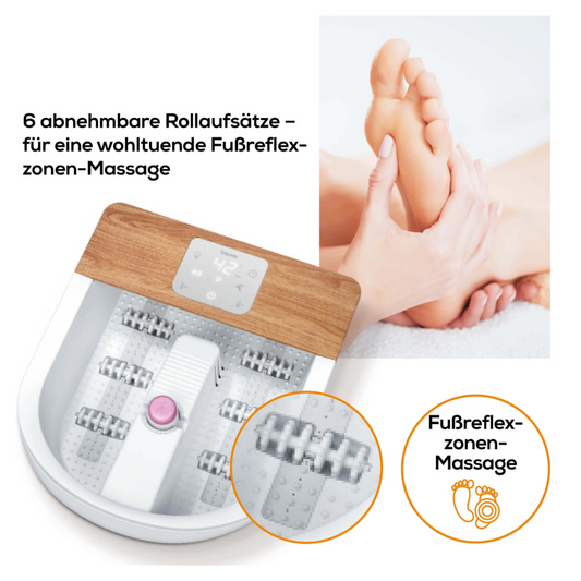 Links ist das Beurer FB 65 Wellness Fußsprudelbad der Beurer GmbH mit eleganten Holzakzenten und sechs abnehmbaren Massagerollen für eine wohltuende Fußreflexzonenmassage abgebildet. Rechts massiert ein Paar Hände den Fuß einer Person. Der deutsche Text lautet „6 abnehmbare Rollen für eine entspannende Fußreflexzonenmassage“.