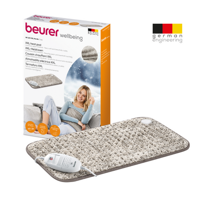 Image of a Beurer HK 123 XXL Nordic heating pad in XXL format with packaging. The textured gray heating pad features a white controller and offers 3 heat settings for customizable comfort. The packaging shows a woman using the pad, highlights product features in multiple languages, and proudly displays the logo of Beurer GmbH and 'German Engineering'.