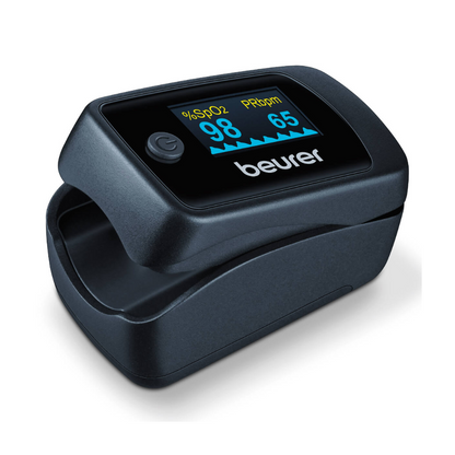 A black Beurer pulse oximeter PO 45 from Beurer GmbH, displaying values of 98% oxygen saturation and 65 PRbpm on its digital display. The device has a sleek design and appears to be compact and portable.