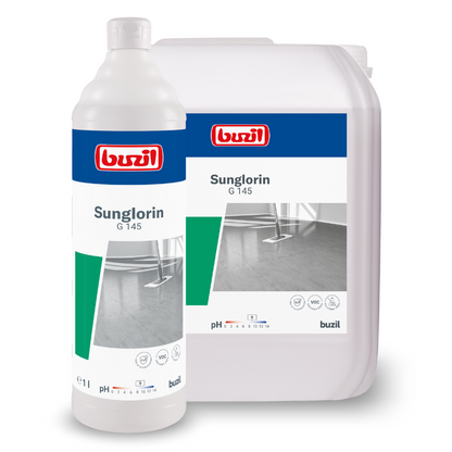 In front of a plain white background, there is a plastic bottle and a large container with Buzil Sunglorin G 145 self-gloss emulsion floor cleaner from BUZIL-WERK Wagner GmbH & Co. KG. The packaging, labeled with the product name and a photo of a clean, shiny floor, highlights the self-gloss emulsion for water-resistant coatings.