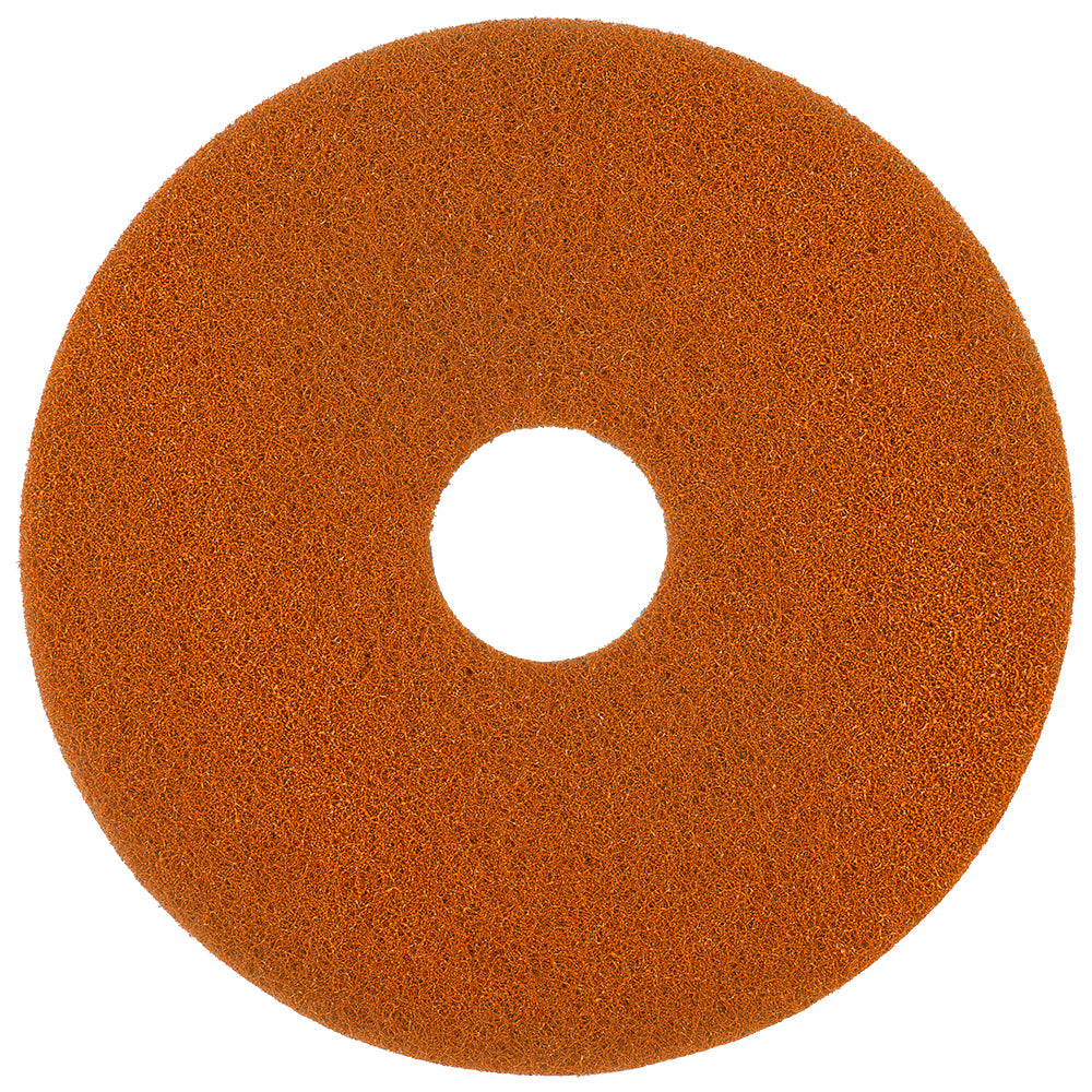 Das Twister Pad orange für Steinböden der Diversey Deutschland GmbH & Co. OHG ist ein rundes, strukturiertes orangefarbenes Bodenpad mit einem zentralen Loch, das für die Steinbodenreinigung mit mikroskopisch kleinen Diamanten entwickelt wurde; abgebildet auf weißem Hintergrund.