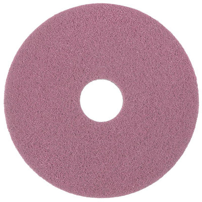The Diversey Twister Pad Pink for vinyl floors from Diversey Deutschland GmbH & Co. OHG is a round, flat cleaning pad with a central hole, enhanced with microscopic diamonds and depicted from above on a white background.