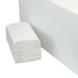 A stack of V-fold folded towels, pure white, 1-ply, made from recycled paper by Diversey Deutschland GmbH & Co. OHG (250 sheets) stands next to a large white box on a simple background.