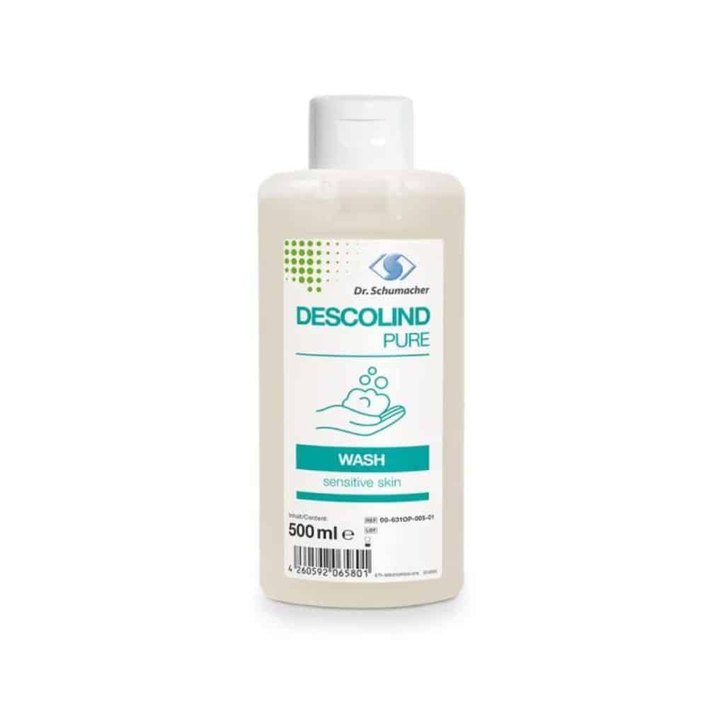 Abgebildet ist eine 500 ml Flasche Dr. Schumacher Descolind Pure Wash Waschlotion der Dr. Schumacher GmbH. Das Etikett ist in blau-weiß gehalten und zeigt ein Diagramm, das Hände zeigt, die mit Seife gewaschen werden, was auf die parfümfreie Formel hinweist.