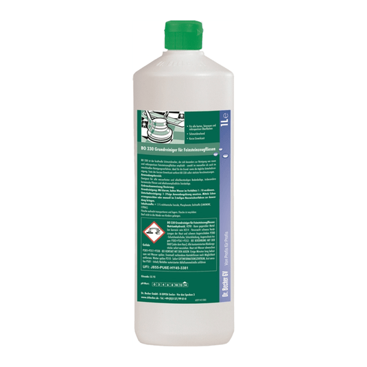 A white plastic bottle with a green cap. The label features green-and-white text with safety and product information, a green illustration of a car, and various hazard symbols. Ideal for cleaning is Dr. Becher BO 330 Basic Cleaner for Porcelain Stoneware Tiles from Dr. Becher GmbH.