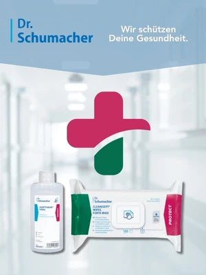 Werbung für Dr. Schumacher Hygieneprodukte. In der Mitte befindet sich ein stilisiertes Kreuzsymbol in Pink und Grün. Im Vordergrund sind zwei Produkte abgebildet: eine Flasche Händedesinfektionsmittel (DESCOSALIN) und eine Packung CLEANISEPT WIPES MAXI Desinfektionstücher. Oben rechts steht der Slogan: ‚Wir schützen Deine Gesundheit.‘ Im Hintergrund ist unscharf ein heller Krankenhausflur zu sehen.