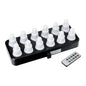 A black charging station holds twelve white, onion-shaped lights from the Duni GmbH LED Set, Warm White & Multicolor - 12 Piece Color Changing Lights. Next to it is a rectangular remote control for easy control of color and mode.