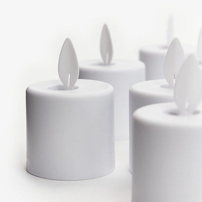 Several Duni GmbH LED Moving Flame candles (38x36 mm, 1 piece) are arranged on a plain white background. Each has a white flame-shaped plastic tip for a realistic, flickering effect.