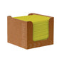 In a dispenser made of brown cardboard, there is a stack of green Duni Bio-Dunisoft napkin boxes Kiwi 20 x 20 cm from Duni GmbH, marked on the side with the print "NAPKINS" and arrows. Through the open sides, the biodegradable napkins are visible and organized.