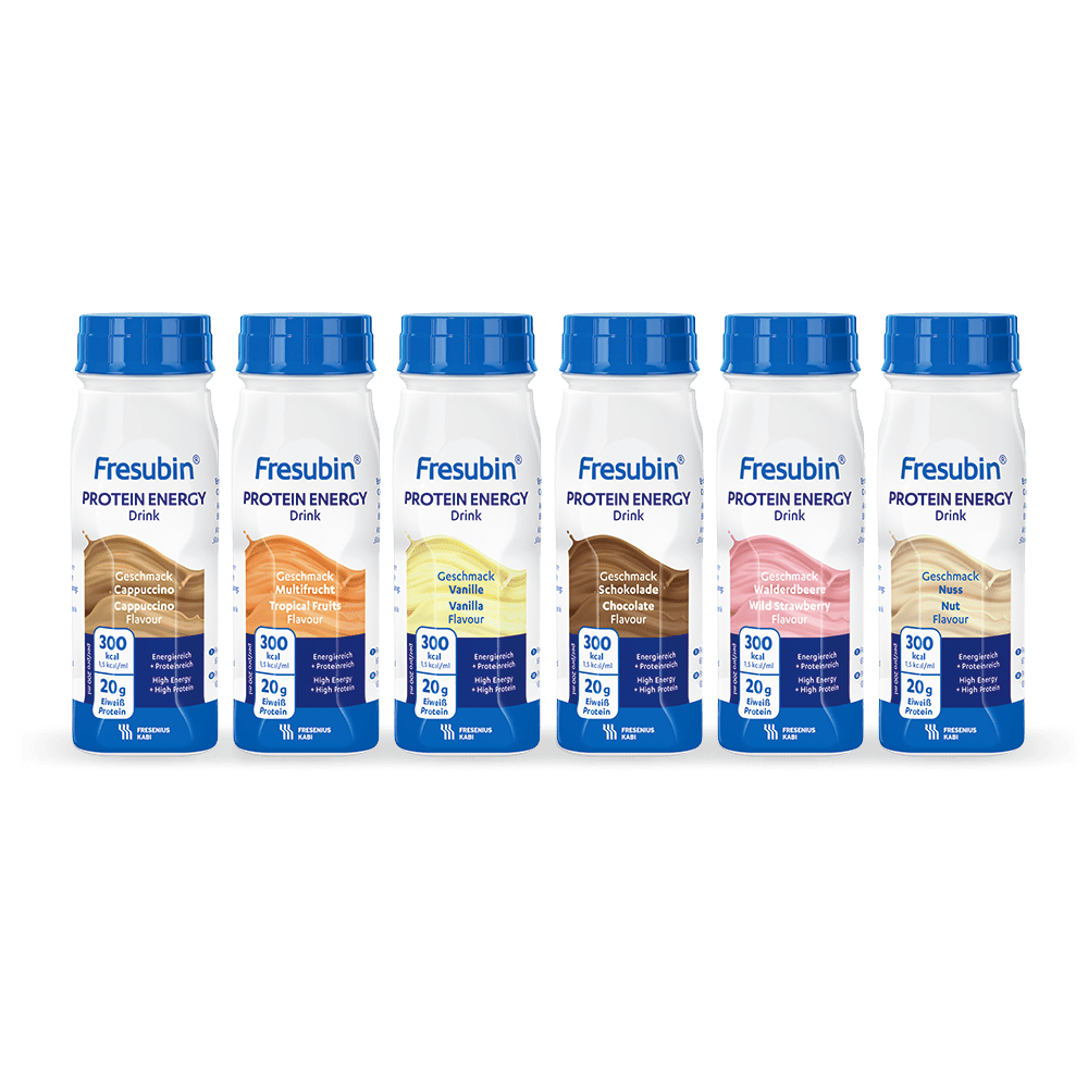 Six bottles of Fresubin Energy Drink mixed carton 200 ml from Fresenius Kabi Deutschland GmbH are lined up, each with a blue cap and label. The package contains a mix of flavors such as cappuccino, vanilla, and chocolate.