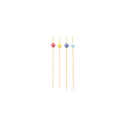 Four 12 cm large PAPSTAR finger food skewers, each decorated with a striped bead in red, yellow, blue, and light blue, are arranged in a row. The stylish products of PAPSTAR GmbH are made as sustainable disposable products and rest elegantly on a simple white background.