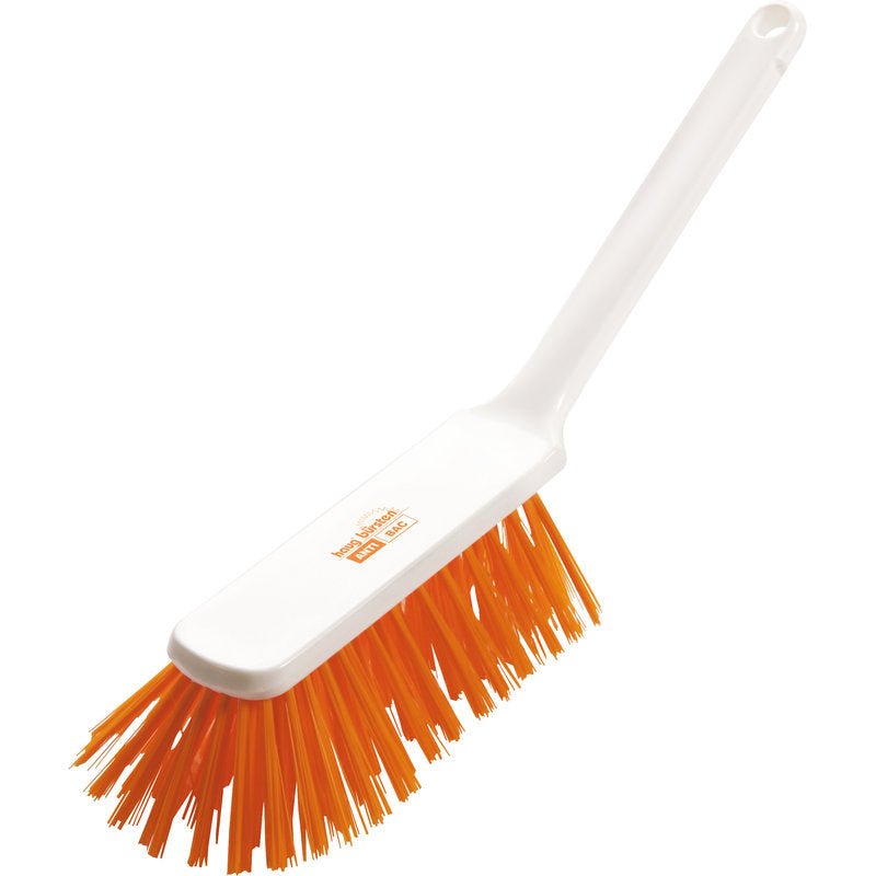 The Haug Bürsten KG ANTI BAC HAND BROOM has hard orange PBT bristles (0.50 mm) and a white plastic handle with a hanging hole, measuring 310 x 40 x 45 mm for effective and hygienic cleaning. Pictured against a white background.
