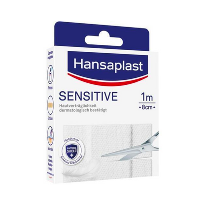 Packaging for Hansaplast Sensitive Plasters - Various sizes by Beiersdorf AG. The box features the brand logo, the product name, and an image of scissors cutting a strip of plaster. The packaging highlights the dermatological approval.