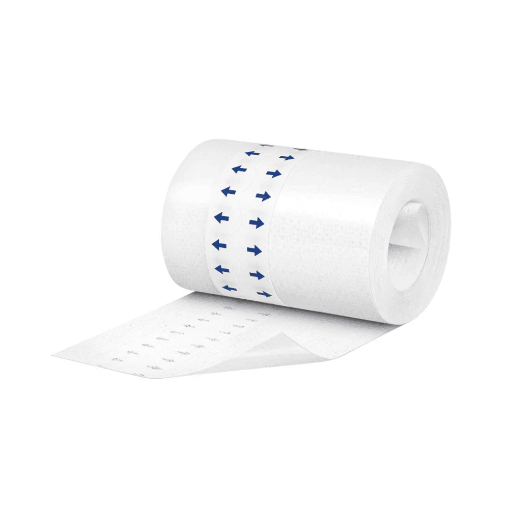A roll of white toilet paper with a blue arrow pattern, partially unrolled and covered with Hartmann Omnifix silicone fixation fleece from Paul Hartmann AG, isolated on a white background.