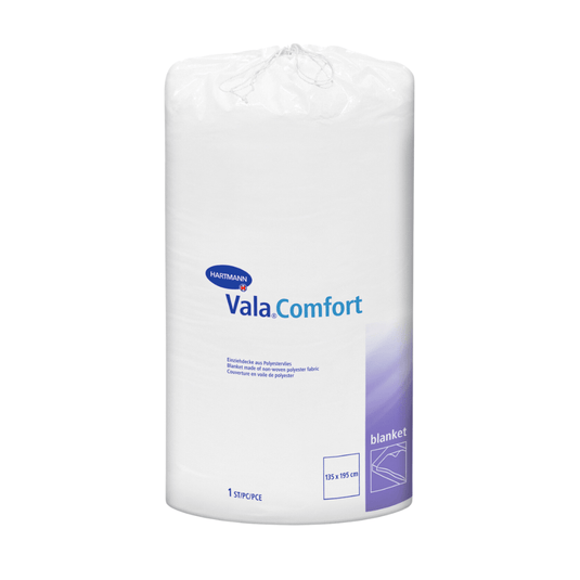 A sealed white roll of Hartmann Vala®Comfort pull-up blankets from Paul Hartmann AG, pictured against a white background. The label shows product details and dimensions (155 x 210 cm).