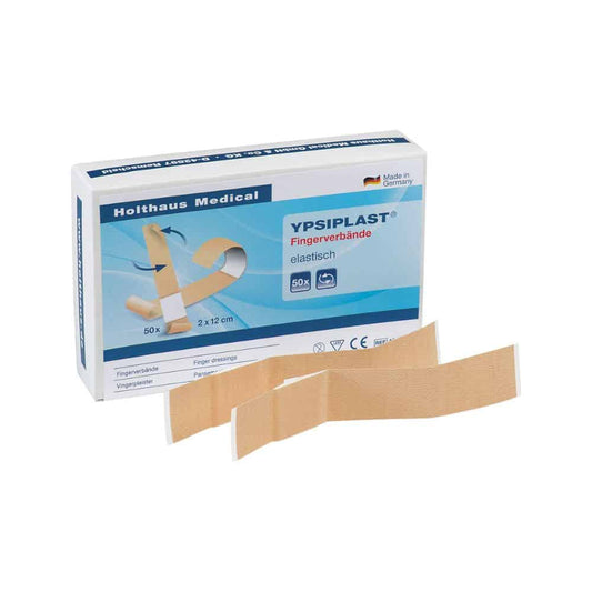 Ausgestellt ist eine Schachtel Holthaus Medical YPSIPLAST® Fingerverband, elastisch von Holthaus Medical GmbH & Co. KG, die 50 elastische Binden mit den Maßen 2 cm x 12 cm enthält. Vor der Schachtel sind zwei elastische Fingerverbände platziert. Auf der Verpackung steht stolz „Made in Germany“.