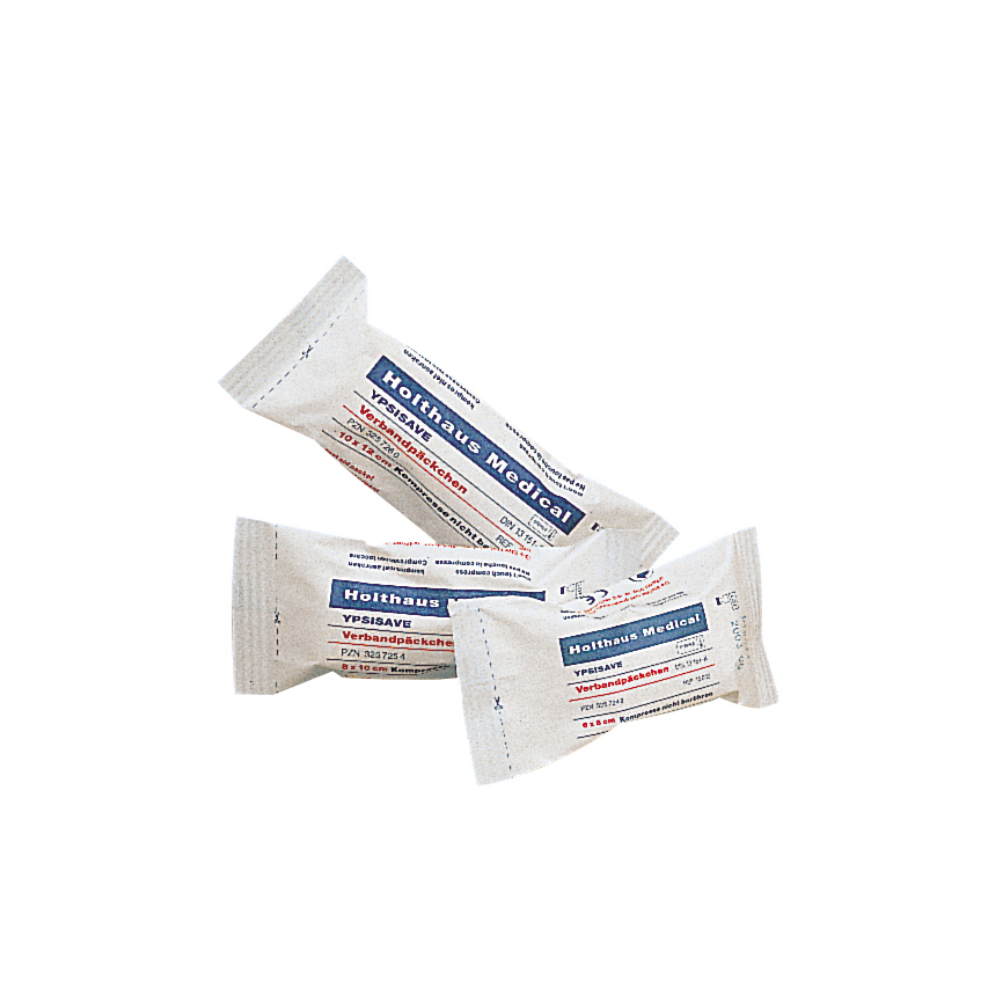 Three sterile medical gauze bandages in white packaging with the inscription 'Holthaus Medical GmbH & Co. KG'. The packaging indicates with blue and red text that it is Holthaus Ypsisave bandage pack 6 x 8 cm, small. These bandages are neatly arranged on a white background.