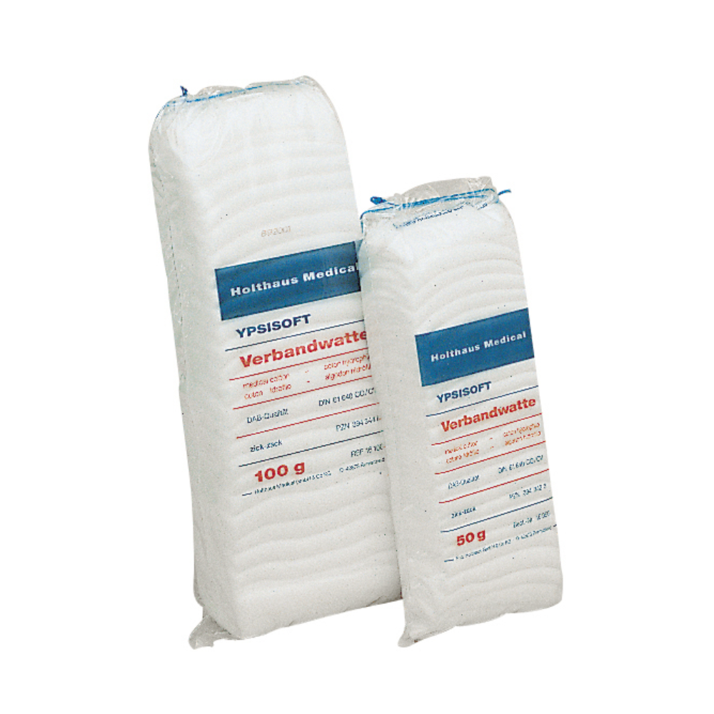 Two white packs of Holthaus Ypsisoft cotton wool, an important medical product for wound care, are arranged vertically. The left pack bears the label "100 g", the right pack the label "50 g". Both packs display text and trademarks, including the name "Holthaus Medical GmbH & Co. KG".