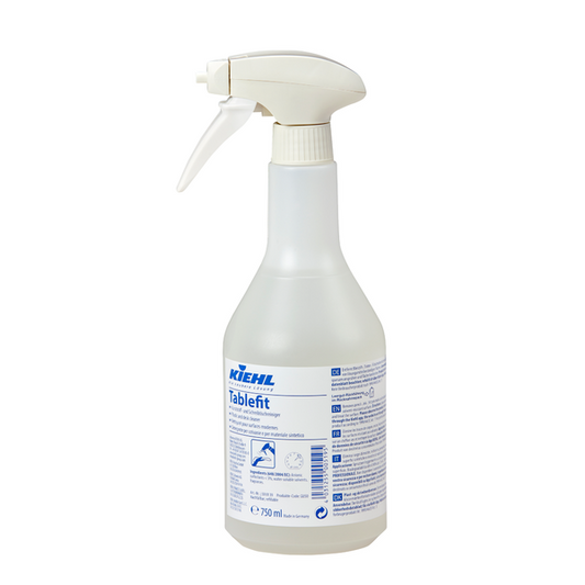 Die weiße 750-ml-Sprühflasche des Kiehl Tablefit Kunststoff- und Schreibtischreinigers der Johannes Kiehl KG ist mit blauer Schrift, einem Sprühkopf und einer Anleitung auf dem Etikett versehen.