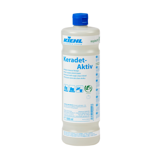 Weiße Kunststoffflasche der Johannes Kiehl KG Kiehl Keradet-Aktiv Alkohol-Universal-Reiniger mit blauem Verschluss und deutschem Etikett mit Anwendungssymbolen und Reinigungshinweisen - ideal für alle Oberflächen.