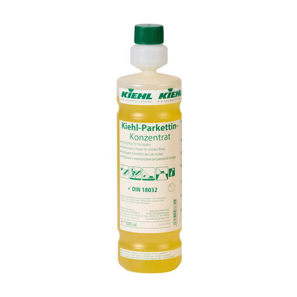 Eine durchsichtige Kunststoffflasche mit gelber Flüssigkeit mit der Aufschrift "Kiehl Parkettin-Konzentrat Wischpflege für Holzböden" der Johannes Kiehl KG, mit grünem und weißem Branding und Anwendungshinweisen auf dem Etikett.