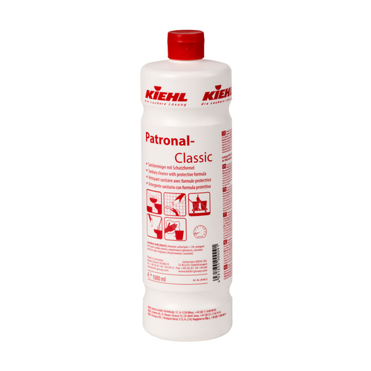 Die weiße 1-Liter-Flasche des Kiehl Patronal-Classic Sanitärreinigers mit Schutzformel der Johannes Kiehl KG ist mit roter Kappe, roter Schrift, mehrsprachigen Hinweisen, Anwendungssymbolen und Produktdetails versehen und hebt die biologisch abbaubare Schutzformel hervor.