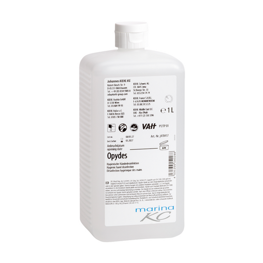 Weiße 1-Liter-Kunststoffflasche mit Flip-Cap und weißem Etikett mit schwarzer und blauer Schrift, Produktinformation, Symbolen und der Marke "Johannes Kiehl KG". Das Produkt "Kiehl Opydes Hygienische Händedesinfektion" sorgt für eine effektive Keimreduktion.