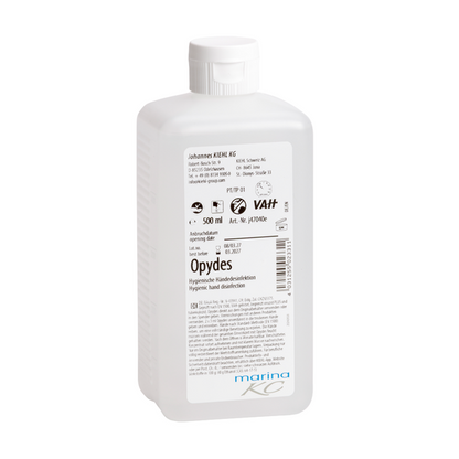 Weiße 500-ml-Kunststoffflasche Kiehl Opydes Hygienische Händedesinfektion der Johannes Kiehl KG mit weißem Verschluss und Etikett mit Anwendungshinweisen, Dosierungsangaben, Herstellerinformationen und Zertifizierungslogos.