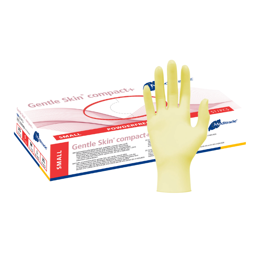 A Meditrade Gentle Skin® Latex Gloves compact+ disposable glove with the inscription 'Gentle Skin Compact', indicating that it is a small, powder-free medical glove designed for the food processing industry. The packaging is red.