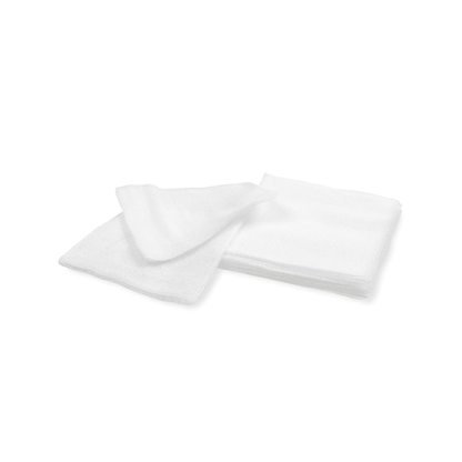 Two white terry towels from Meditrade GmbH, neatly folded and overlapping each other on a sterile white background.