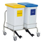 The Novocal recyclable collector dual collector consists of two rectangular containers on a stainless steel cart with wheels, a yellow "Plastic" lid on the left, and a blue "Paper" lid on the right, ensuring efficient waste separation.