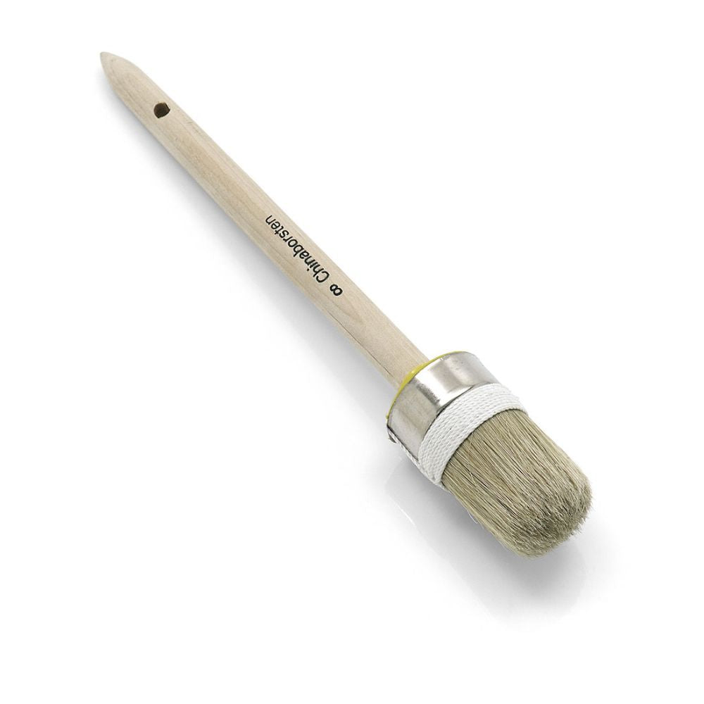 The Nölle Profi Brush industrial ring brush with a light bristle mix and simple thread binding is ideal for precise painting work. It features a wooden handle, a visible logo, a metal ferrule, and a hole at the end for easy hanging, offering quality and style from Nölle Profi Brush Brushes & Brush Technology e.K.