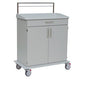 A white Novocal care and work cart with a flat full plastic top, a drawer, two cabinet doors with metal handles, four wheels with red safety locks, and a metal rail along the rear edge for additional utility.
