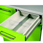 A green kitchen drawer with a metal handle opens, revealing a Novocal cross divider for drawer (170 mm), an adjustable white plastic organizer from Novocal, which is ideal for organizing drawers. The cabinet is green and the countertop is gray.