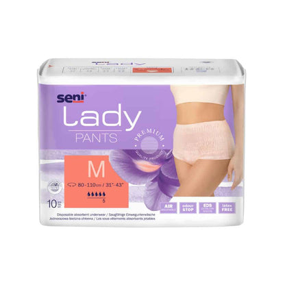 A package of the absorbent underwear Seni Lady Pants in size Medium, developed for incontinence, shows an image of the product on a female model. The packaging highlights features such as breathability and security. The product is from TZMO Deutschland GmbH.