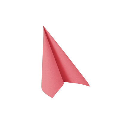The pink napkin PAPSTAR 20 napkins "ROYAL Collection" (40x40 cm, 1/4-fold) from PAPSTAR GmbH is folded into a triangle and stands upright on a simple white surface - ideal for an elegant table decoration.