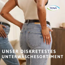 A person in a white tank top and blue jeans stands with hands on hips and is reflected in a mirror. The TENA logo appears in the upper right corner. The text reads: "Our most discreet underwear range with TENA Silhouette Plus Black Incontinence Pants Size M for bladder weakness."