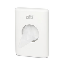 A Tork 566000 hygiene bag dispenser Elevation B5, designed for wall mounting, elegantly presents the brand 'TORK - Essity Professional Hygiene Germany GmbH' at the top. A bag is partially pulled out from the central opening, enhancing both comfort and style in your space.