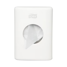 The Tork 566000 dispenser for hygiene bags Elevation B5 from Essity Professional Hygiene Germany GmbH combines style and functionality with its white, rectangular design and round opening, offering an elegant yet practical addition that dispenses a fresh, white towel and enhances the elegance of any bathroom.