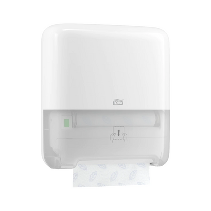 A Tork Matic® 551000 dispenser for roll towels Elevation H1 in white is wall-mounted and displays the TORK logo and an indicator symbol for single sheet dispensing. A patterned roll of roll towels is partially visible, ensuring seamless dispensing with each pull.