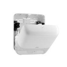 The Tork Matic® 551000 dispenser for roll towels Elevation H1 from TORK – Essity Professional Hygiene Germany GmbH is an elegant and modern white wall-mounted dispenser with an open front that shows the inner mechanism for single sheet dispensing. It features smooth surfaces, rounded edges, and a level indicator.